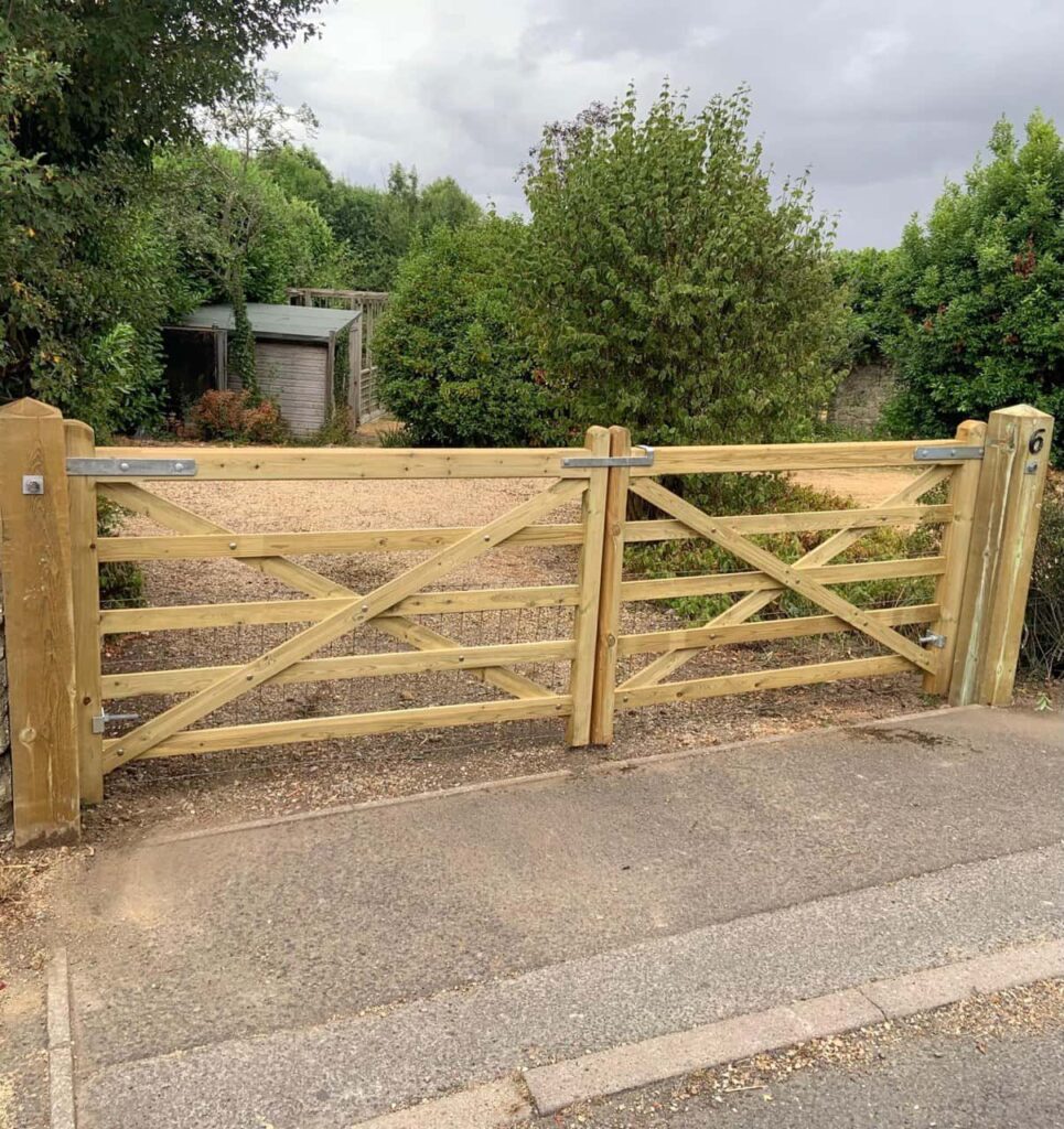 This is a photo of a wooden driveway gate installed by Fast Fix Fencing