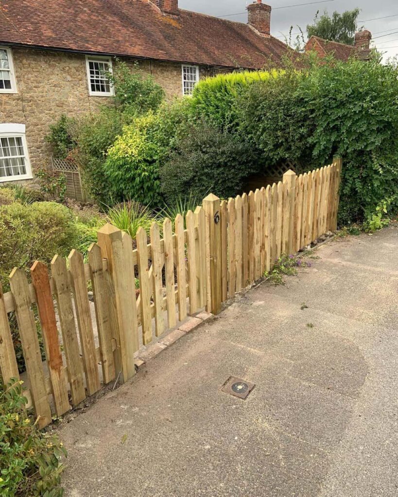 This is a photo of a picket fence and picket gate installed by Fast Fix Fencing