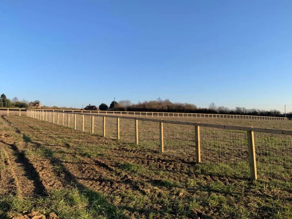 This is a photo of stock fencing installed around a farmers field by Fast Fix Fencing