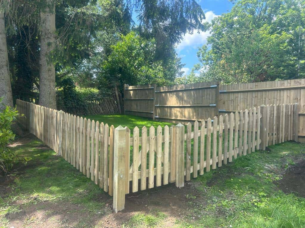 This is a photo of feather edge fencing and picket fencing and a picket gate, all installed by Fast Fix Fencing